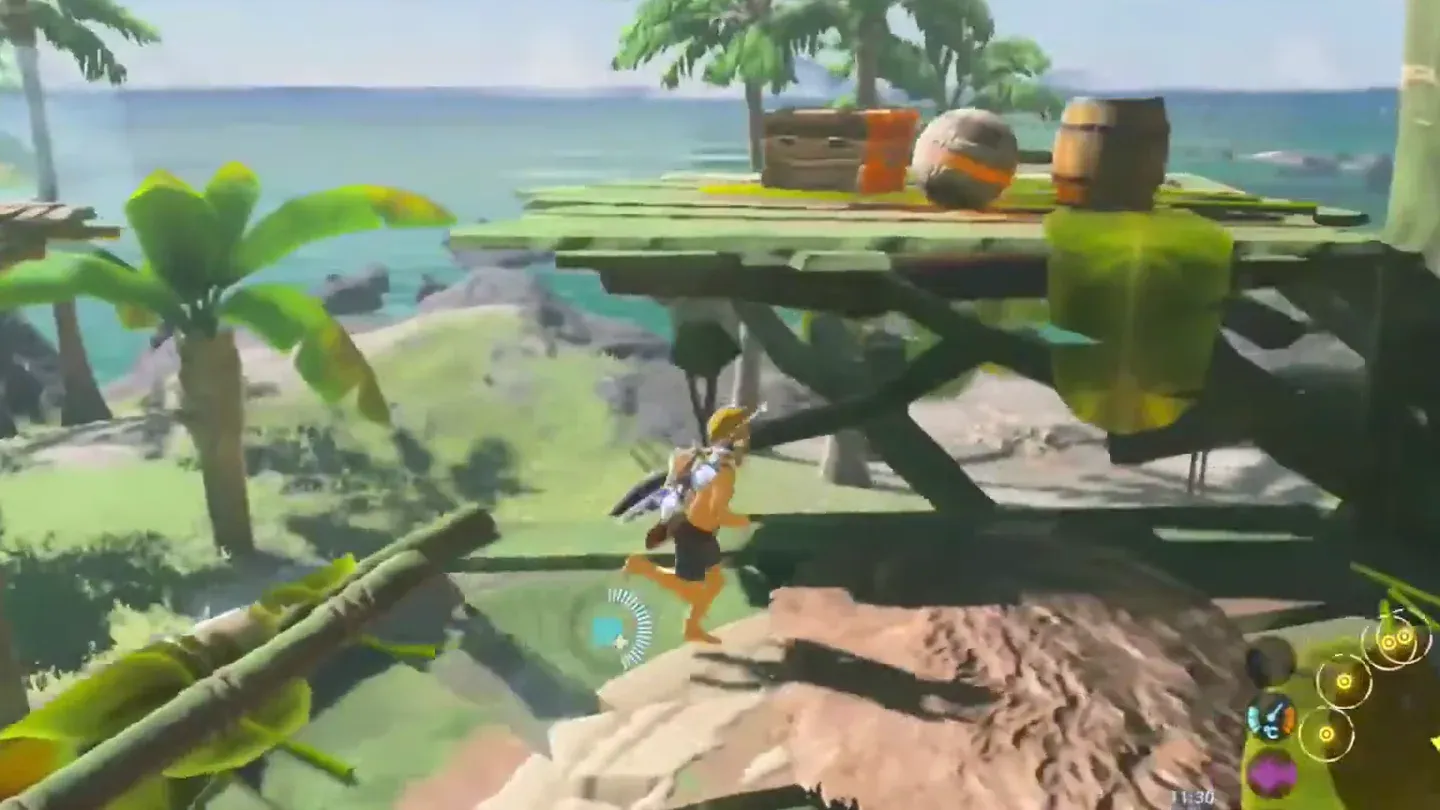Link below a wooden lookout platform in the beach camp with an orb on top