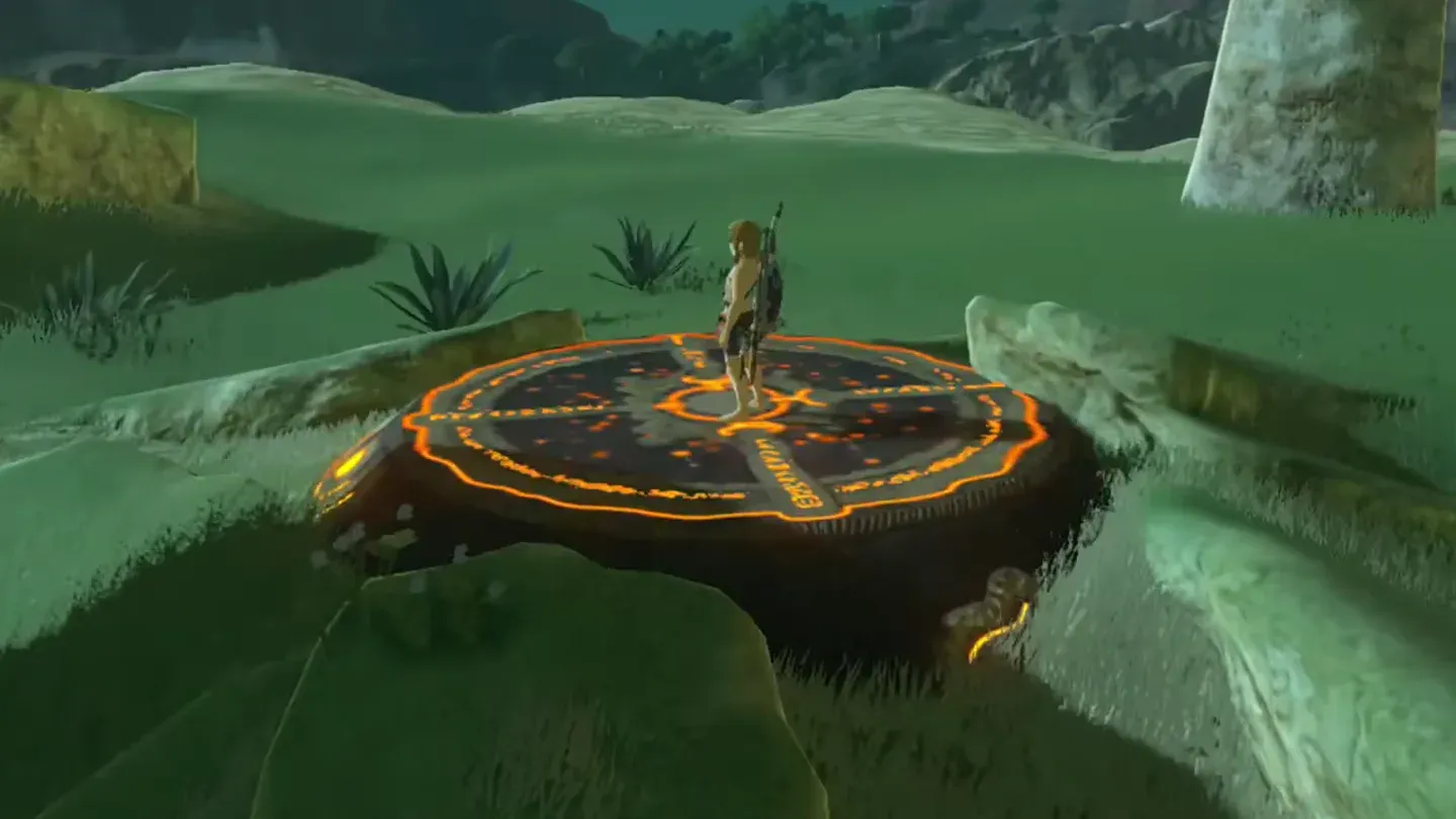 Link without armor standing on the round orange pedestal at night