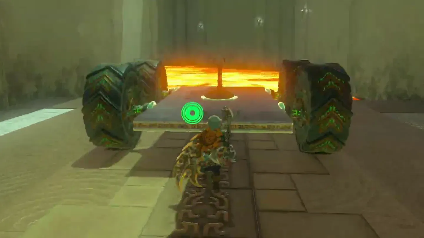 The wheeled cart with its steering stick at the start of the lava channel