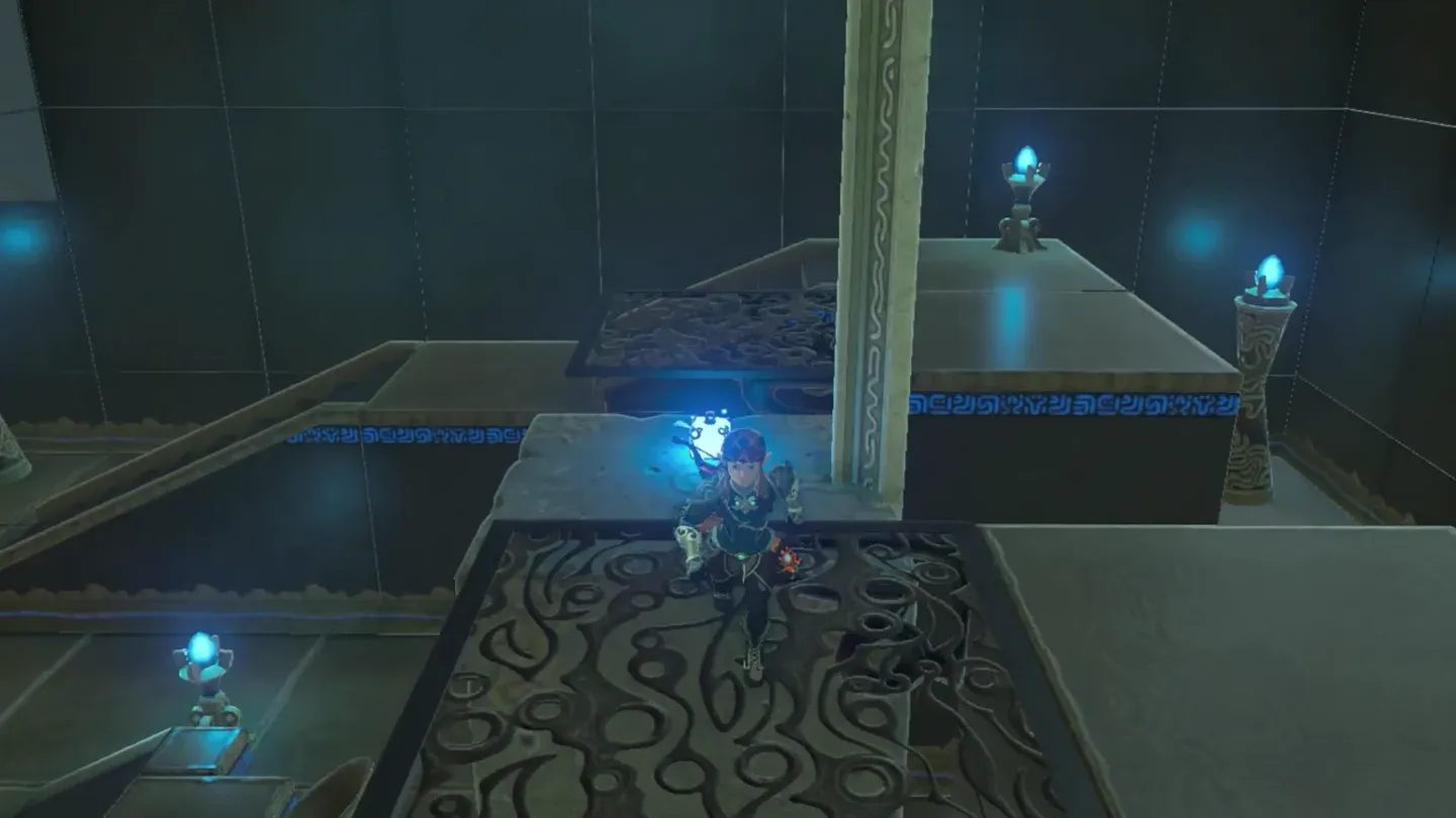 Link on top of the large stone block holding a square Remote Bomb