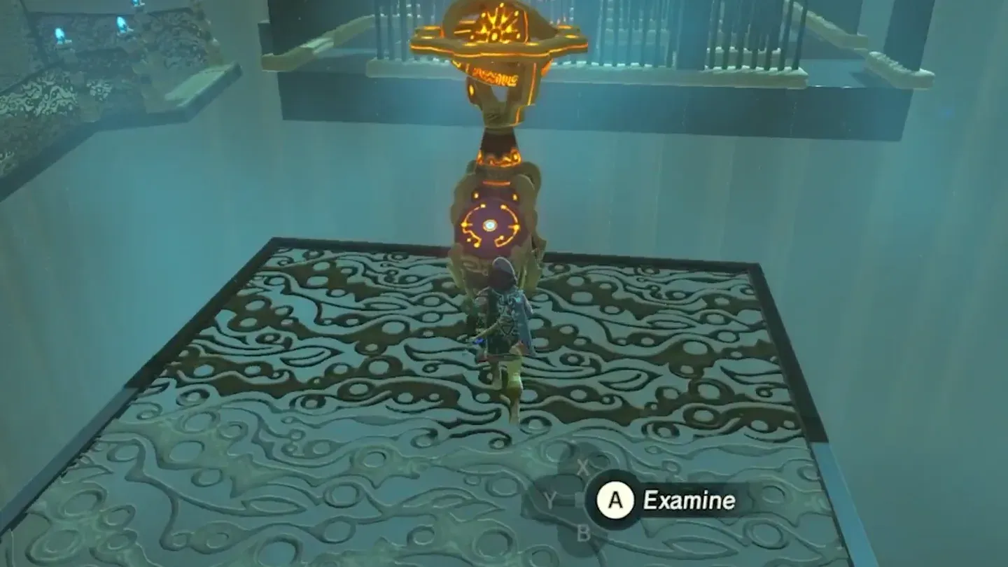 Link at the glowing control pedestal at the top of the stairs