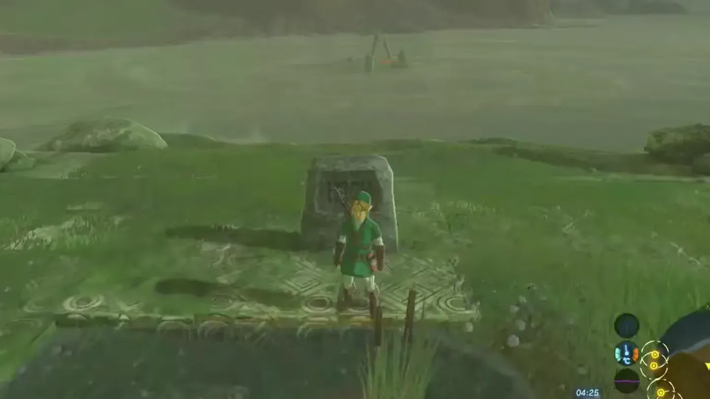 Link standing at a stone tablet among ruins on a grassy peninsula