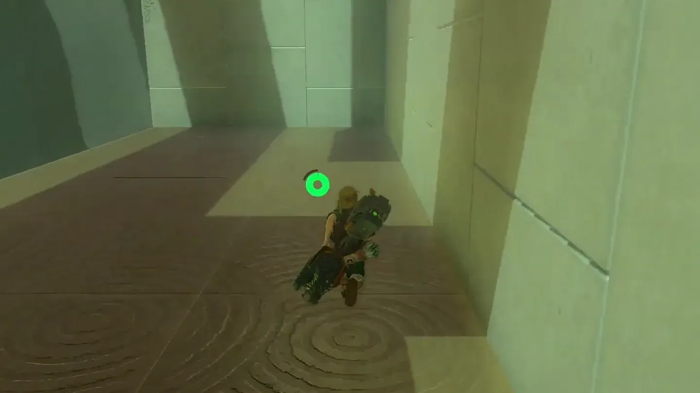Link running toward the left corner of the main room