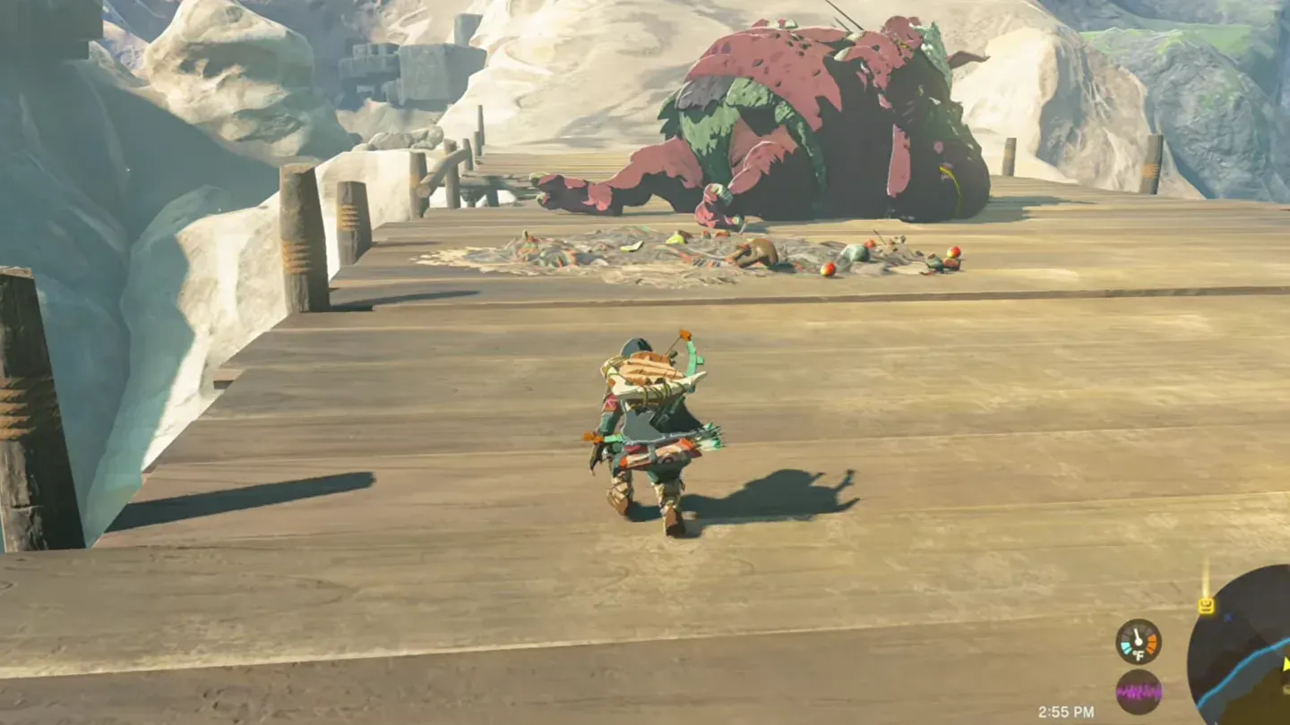 A Hinox asleep across Carok Bridge, Link approaching