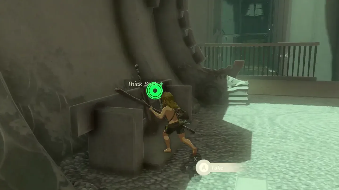 Link picking up the Thick Stick at the entrance