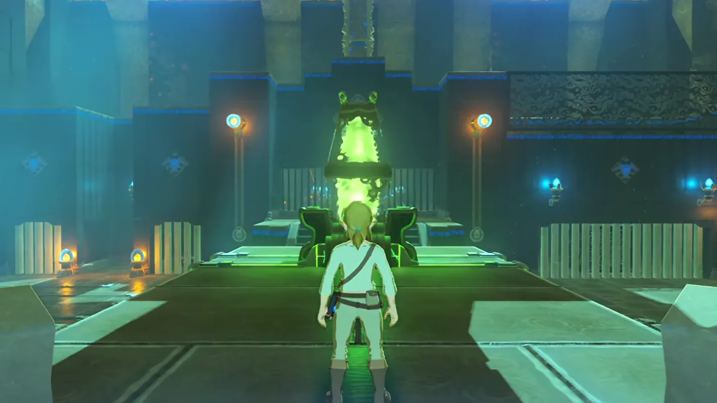 The glowing green power source near the entrance with wires on the floor