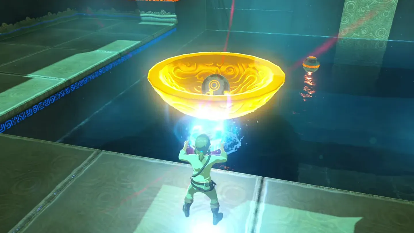 Link lifting the metal bowl with an Ancient Orb inside it out of the pool