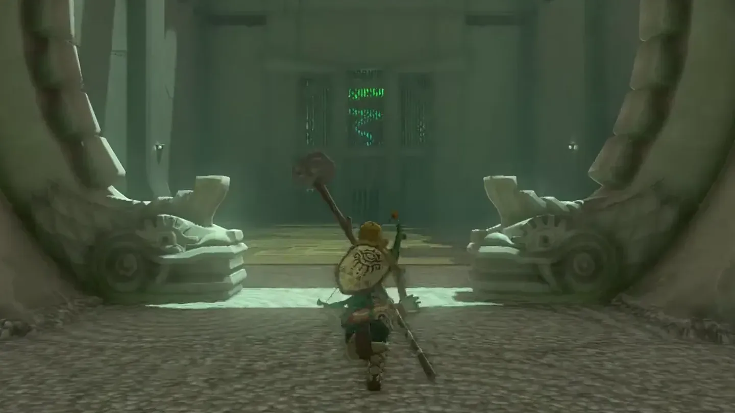 Link walking into Kyononis Shrine between two stone guardians