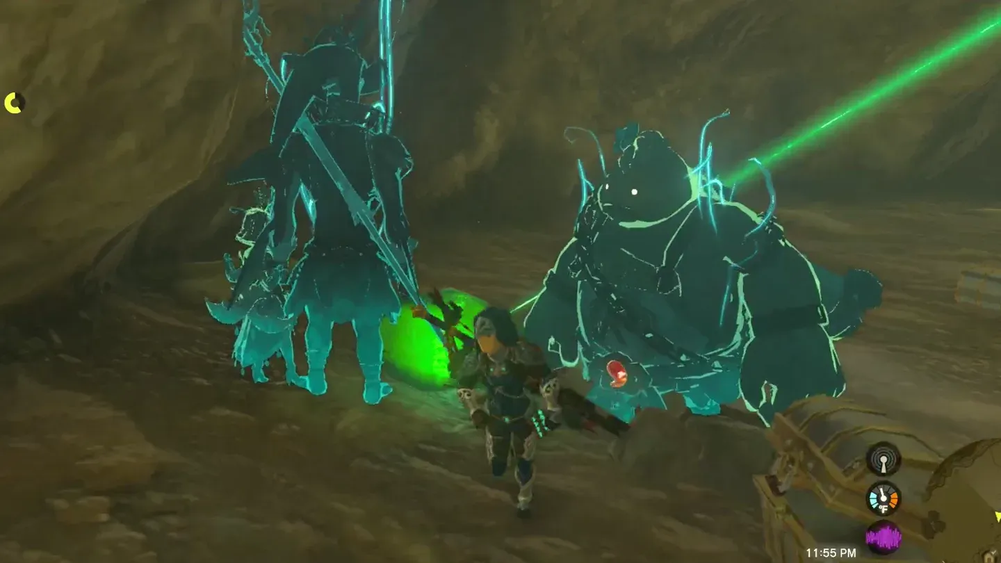 The glowing green crystal on the ground between enemies