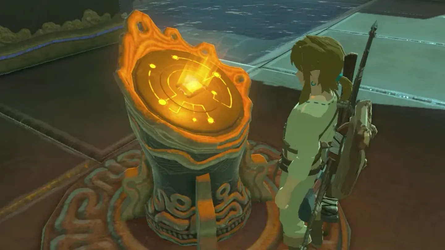 Link beside the glowing orange terminal inside the shrine entrance
