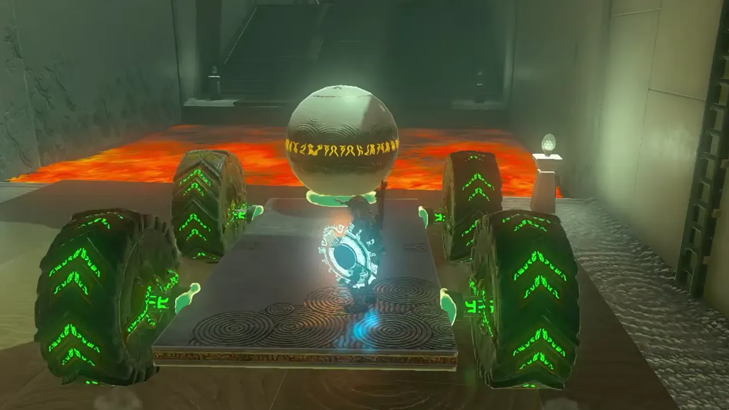 The orb sitting on the wheeled cart at the edge of the lava