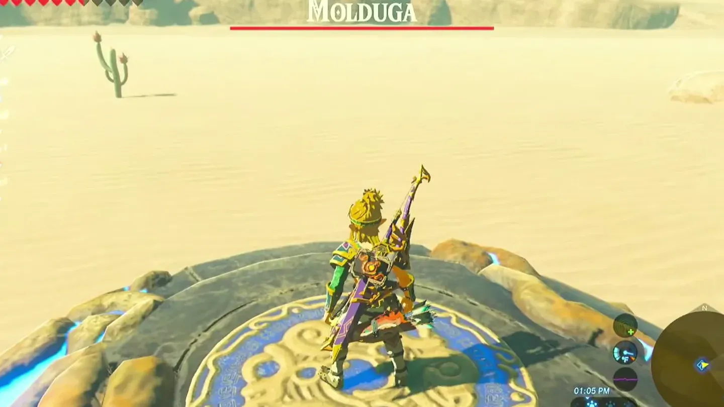 Link standing on a stone platform in the desert