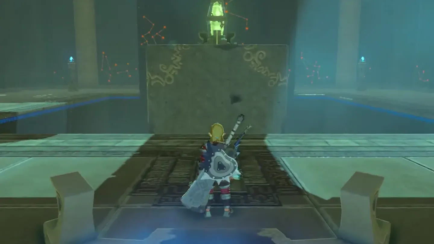 A massive stone block in the center of the shrine with a glowing green generator on top