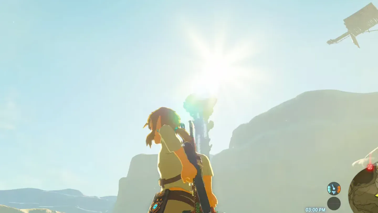 Link on the pedestal looking up toward the bright sun