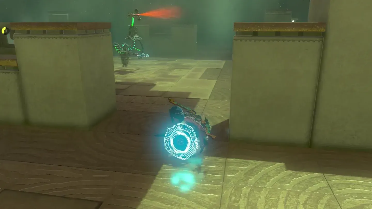 Link crouching behind a pillar with the Construct scanning in the distance