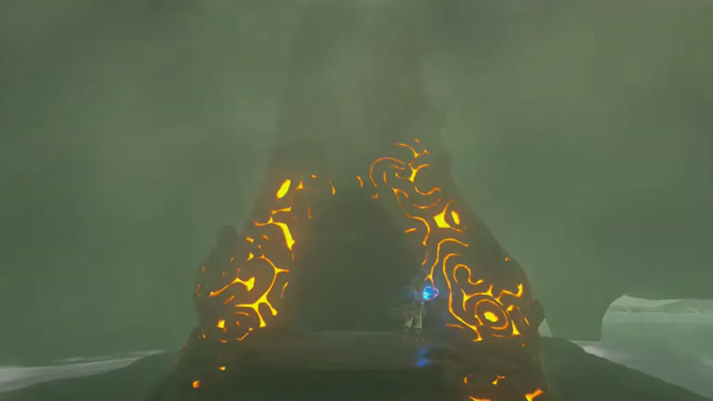The shrine glowing orange in the middle of the cave pool