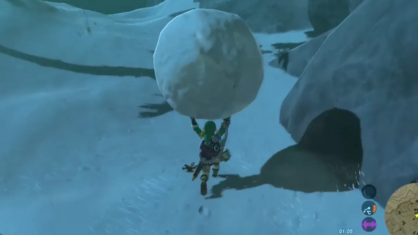 Link carrying a huge snowball over his head