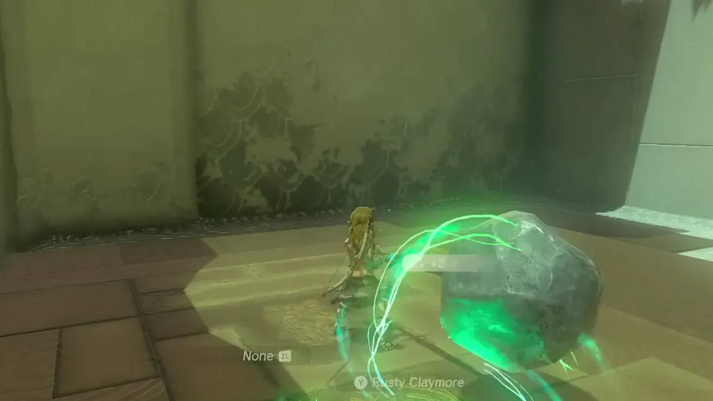 Link fusing the boulder onto his weapon
