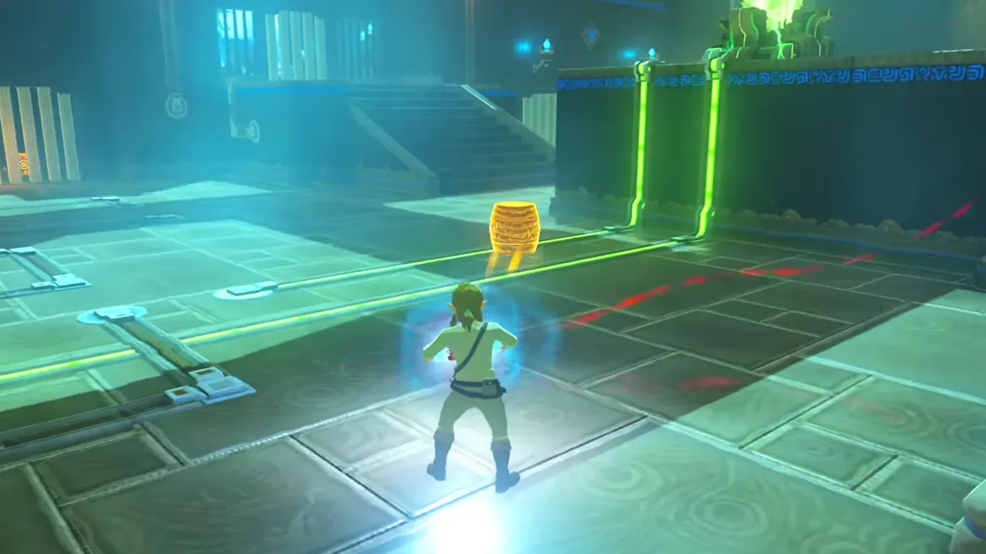 Link moving a metal barrel over a gap in the floor wire