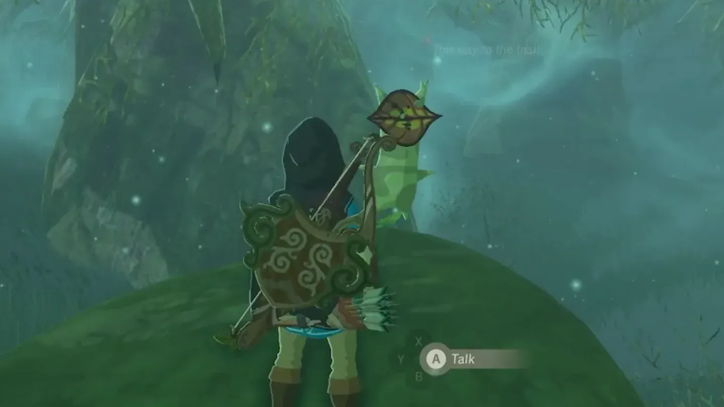 Link beside a small Korok standing on a large rock in the mist