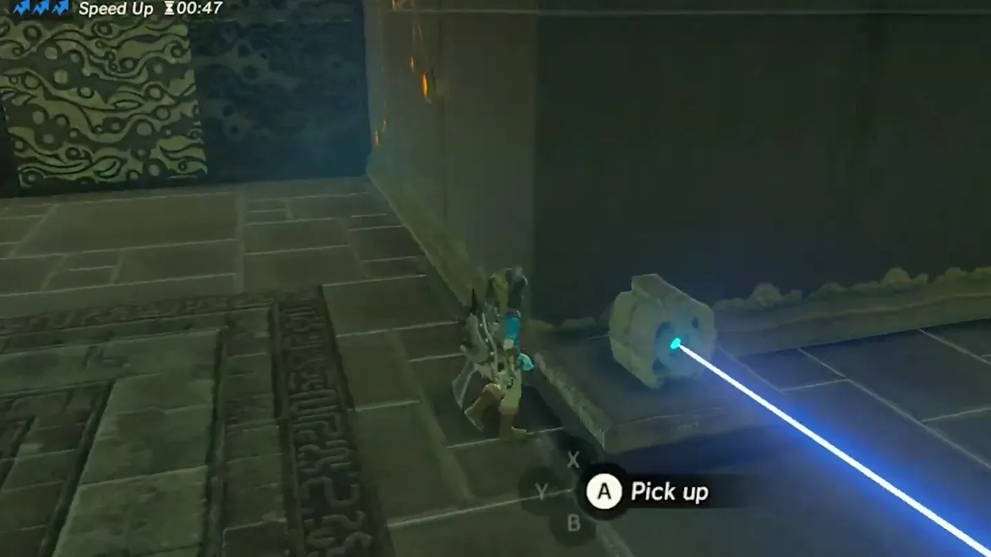 The emitter lying loose on the floor next to Link, still firing its beam