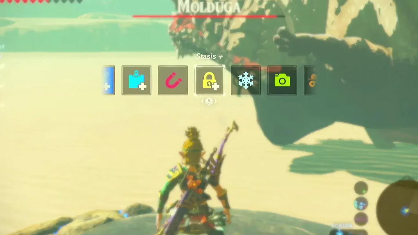 The rune menu with Remote Bomb highlighted, the Molduga's shadow behind