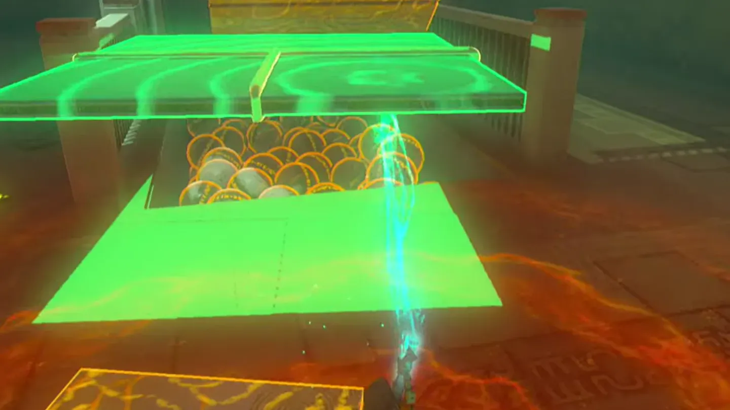 Ultrahand holding two joined metal panels above the pit of balls