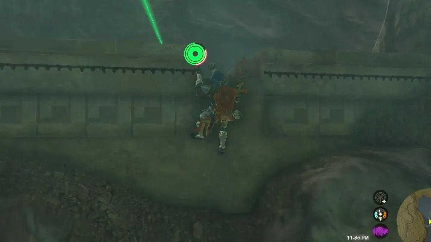 Link climbing toward the cave mouth as the beam passes overhead