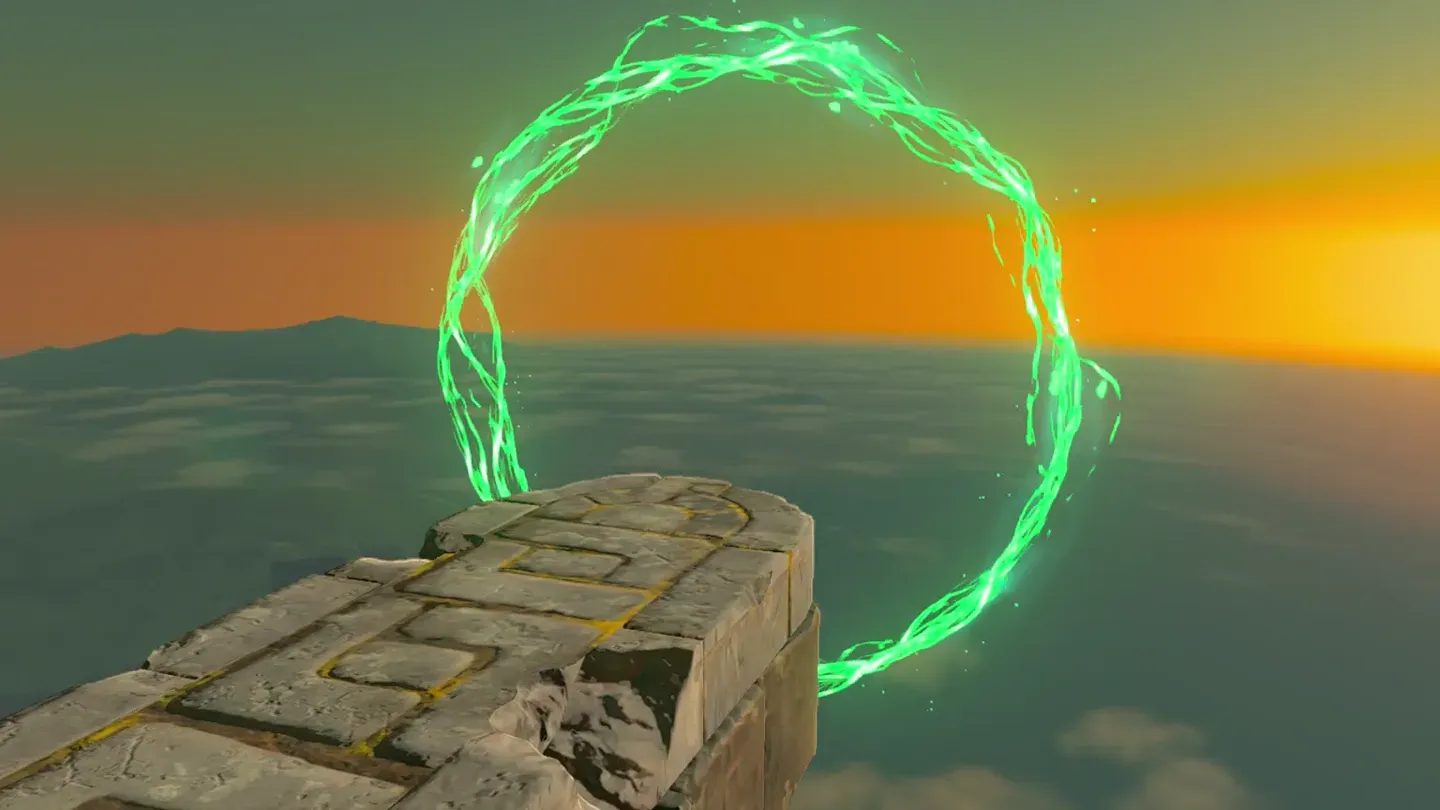 The first green ring hanging beyond the cliff edge at sunset