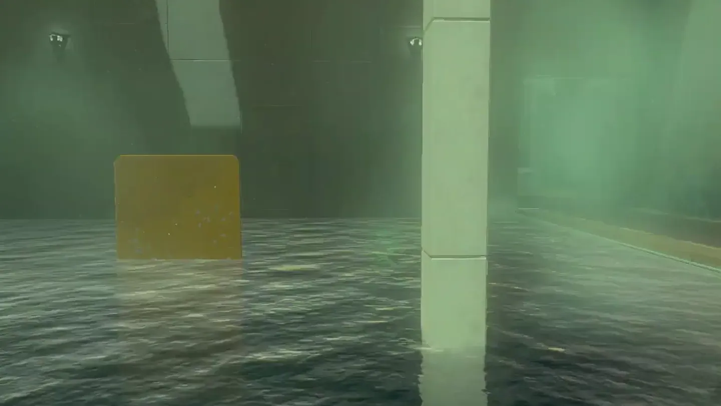 The chest floating at the surface of the pool with the ball attached