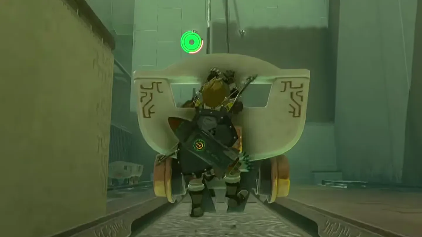 Link riding the rocket cart up the rails