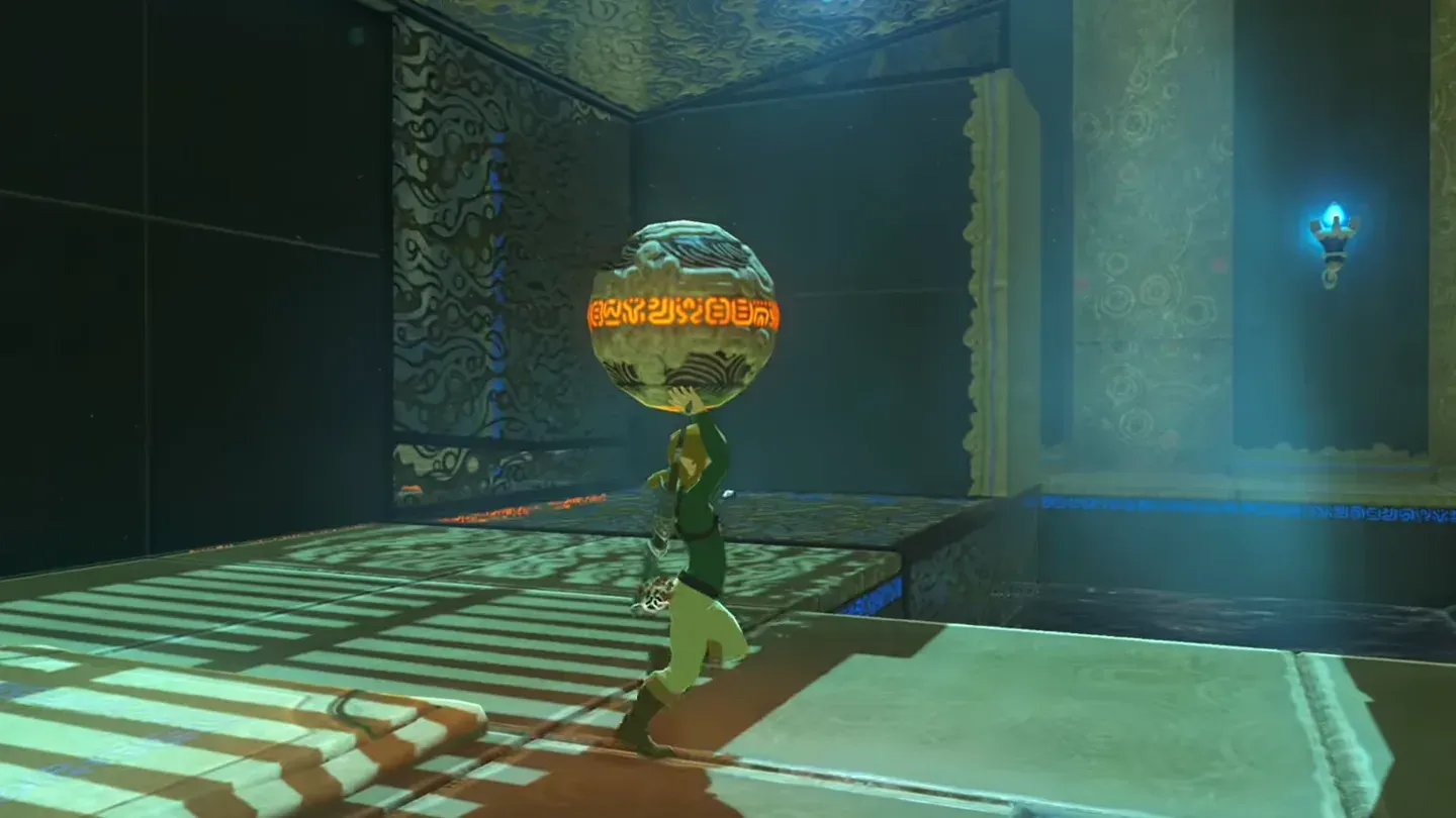 Link carrying the glowing ball over his head