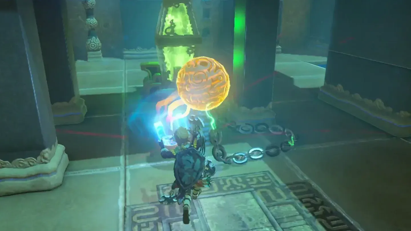 Link swinging the chained metal ball around the column