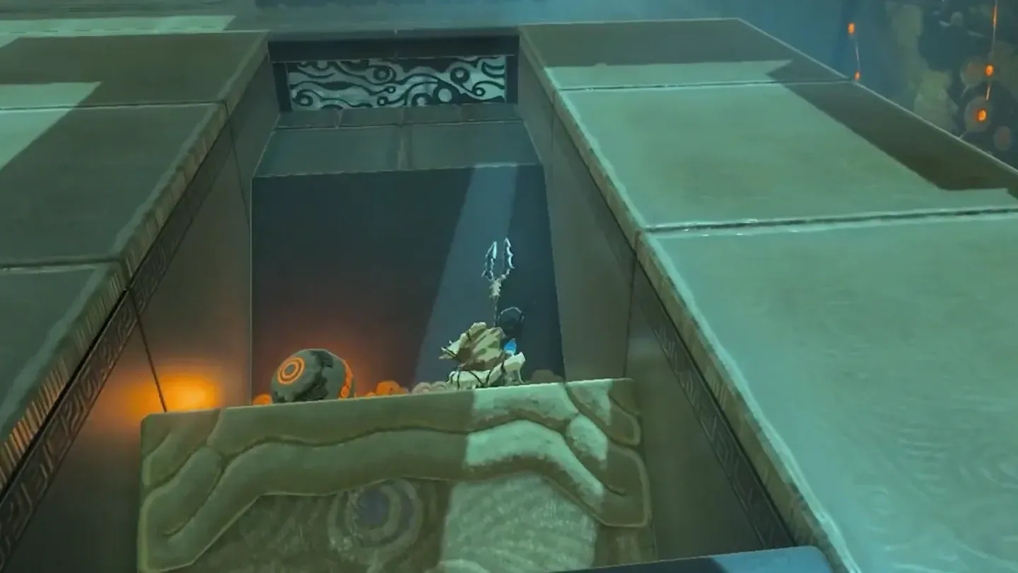 Link drops the orb into the launcher pit
