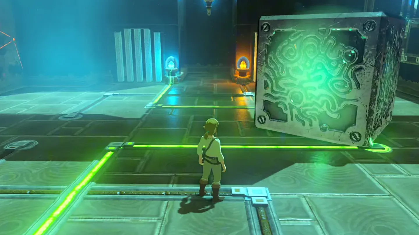 The big metal cube sitting in the large gap, glowing with current