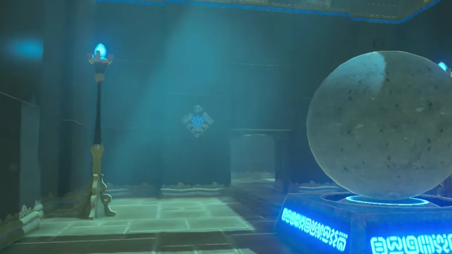 A large boulder resting on a glowing blue floor switch