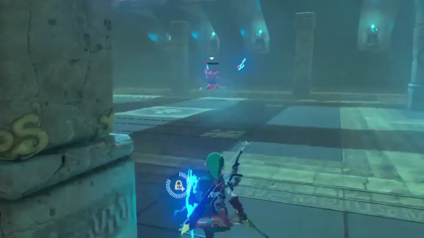 Link beside a stone pillar with the Guardian Scout across the arena