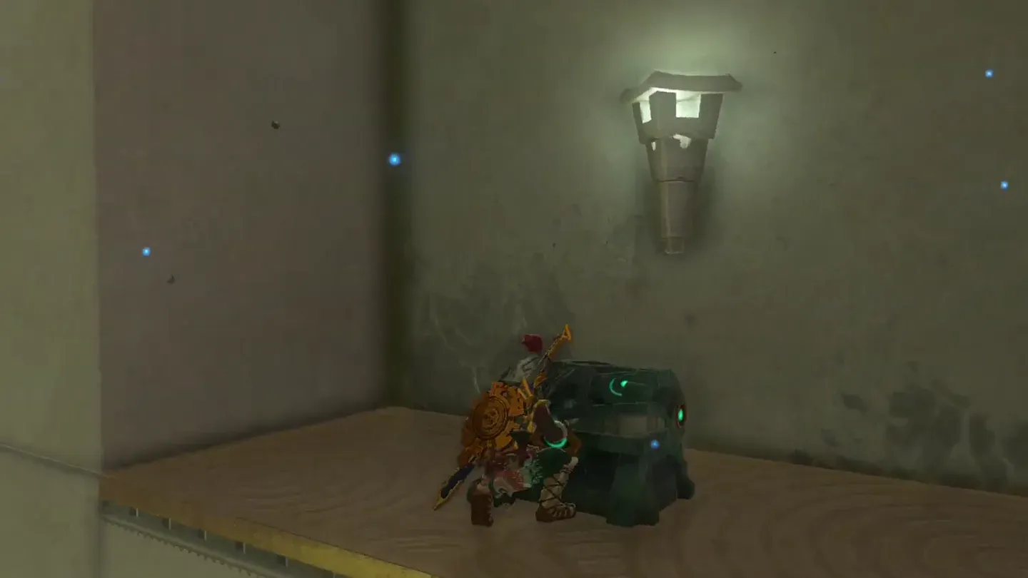 Link opening the chest on the ledge below the target