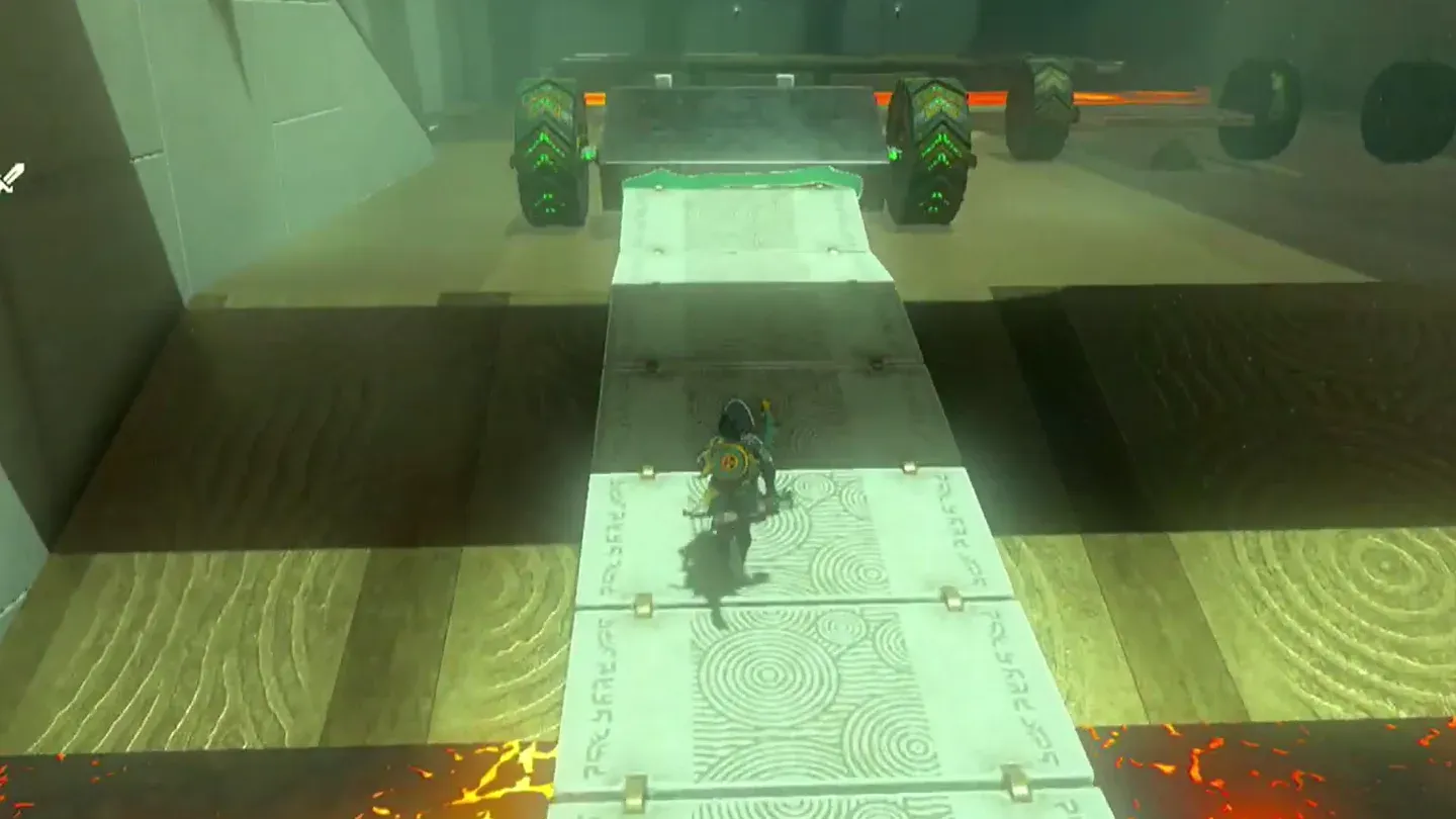 Link riding the wheeled slab bridge over the lava