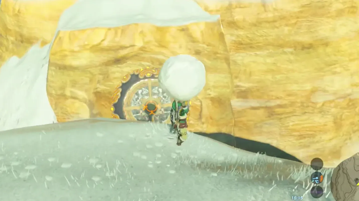 Link holding a snowball over his head in front of the pedestal