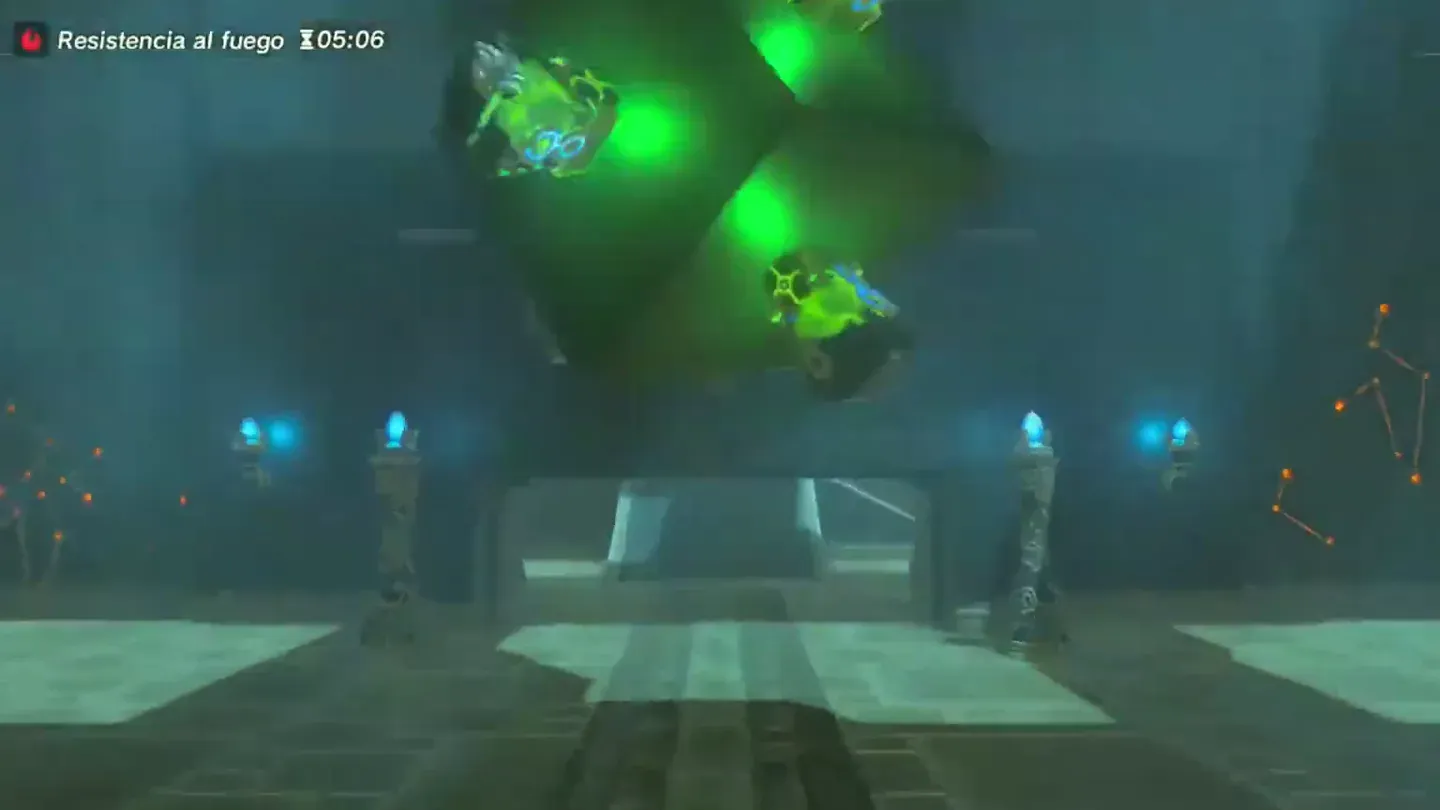 The hanging cube with its lamps glowing green
