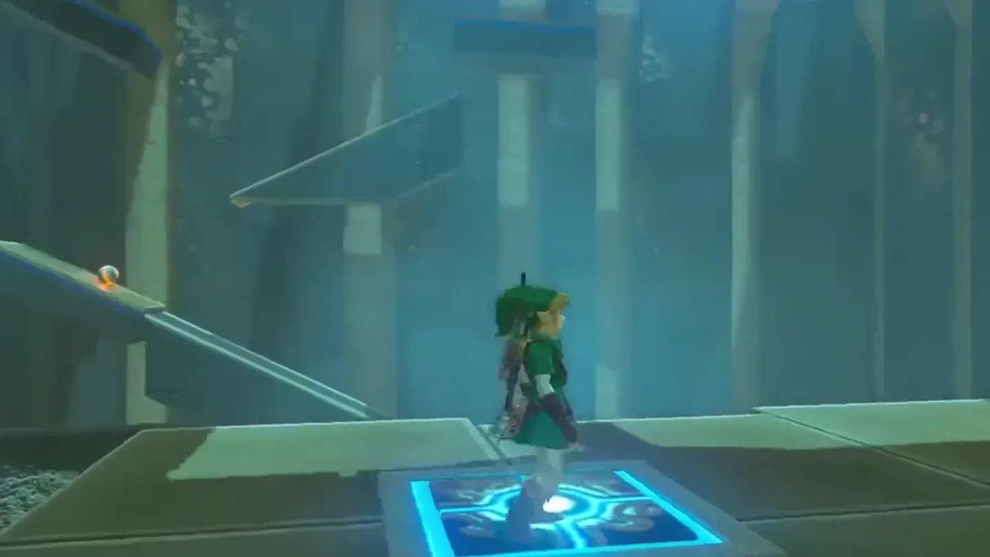 Link holding down a switch while a ball rolls along the ramp above