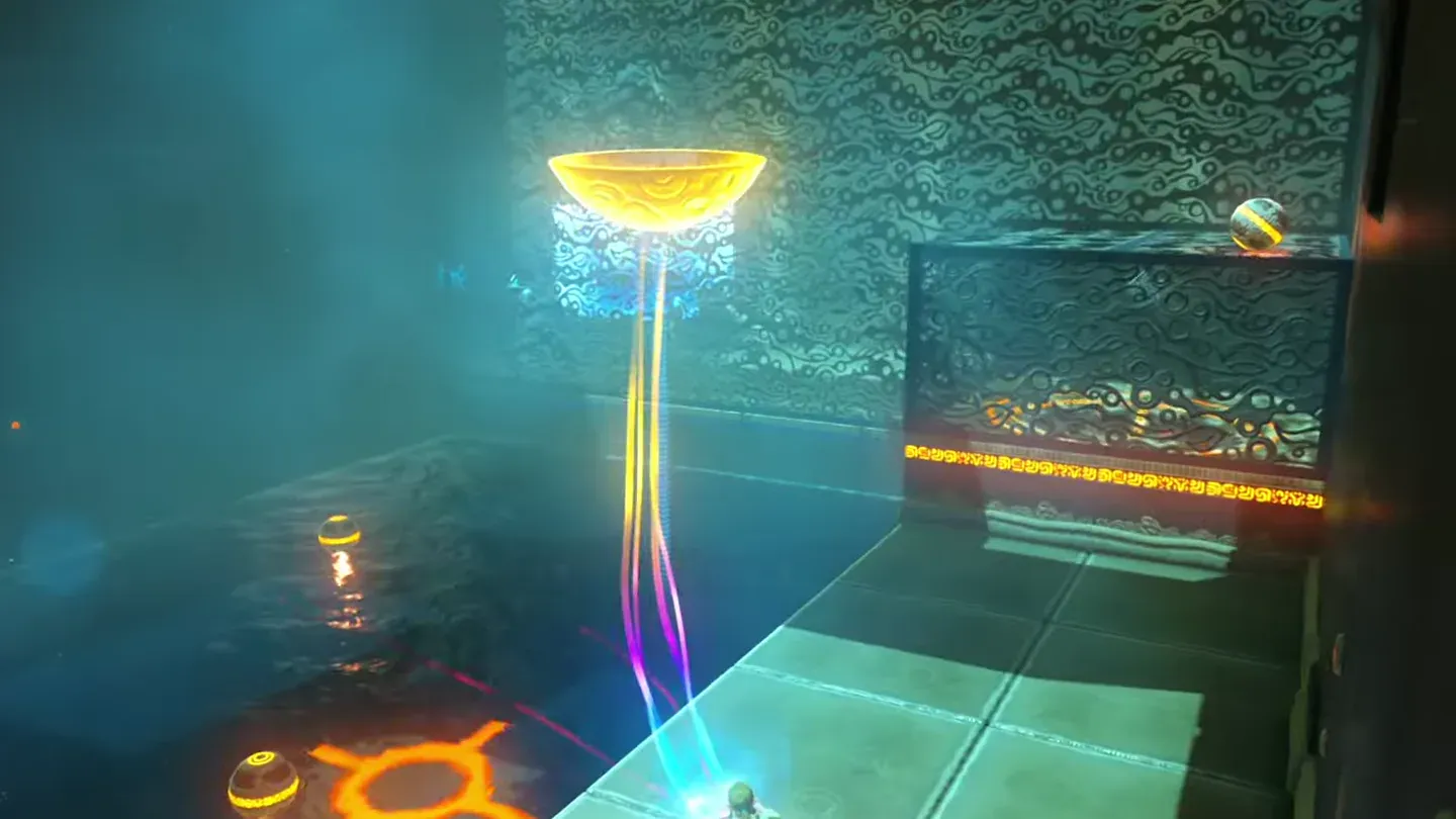 An orb resting on top of the covered grate on the right, bowl held nearby