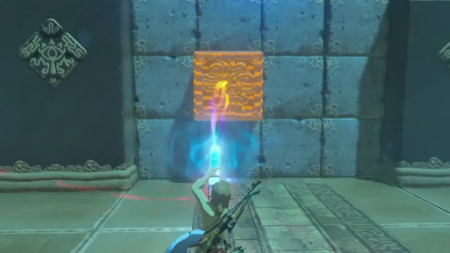 Link pulling a metal cube out of the stone wall