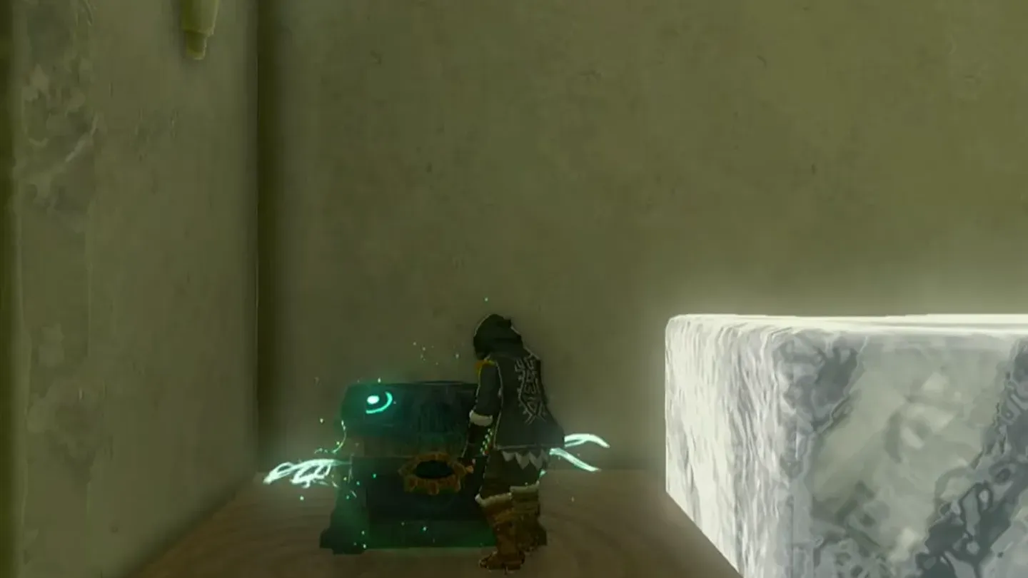Link opening the chest on the raised platform beside an ice cube