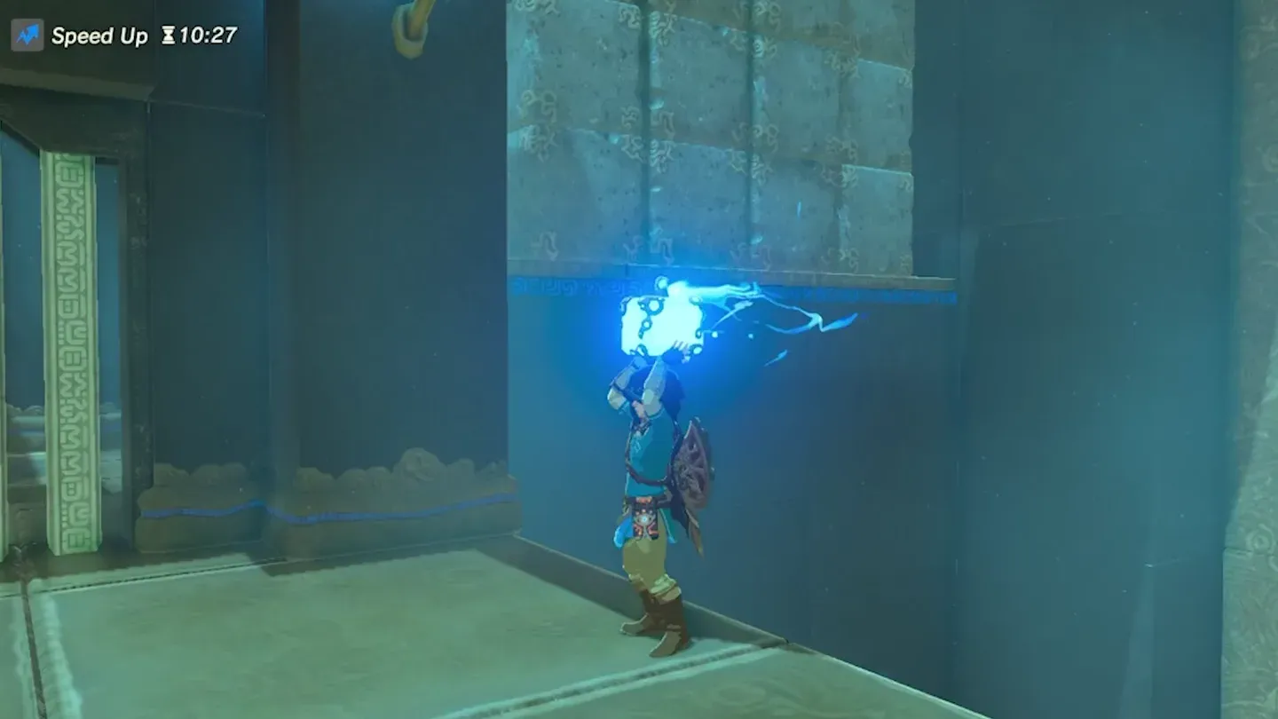 Link placing a glowing blue Remote Bomb against a stack of stone cubes