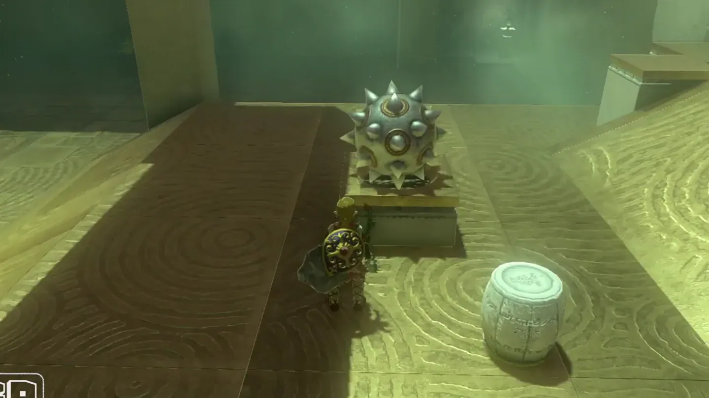 A Spiked Iron Ball on a pedestal in front of the altar gate