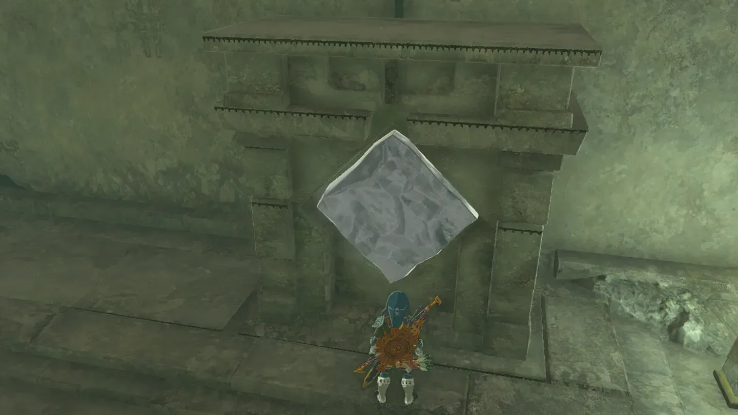 A melted-down ice panel sitting in a smaller stone recess