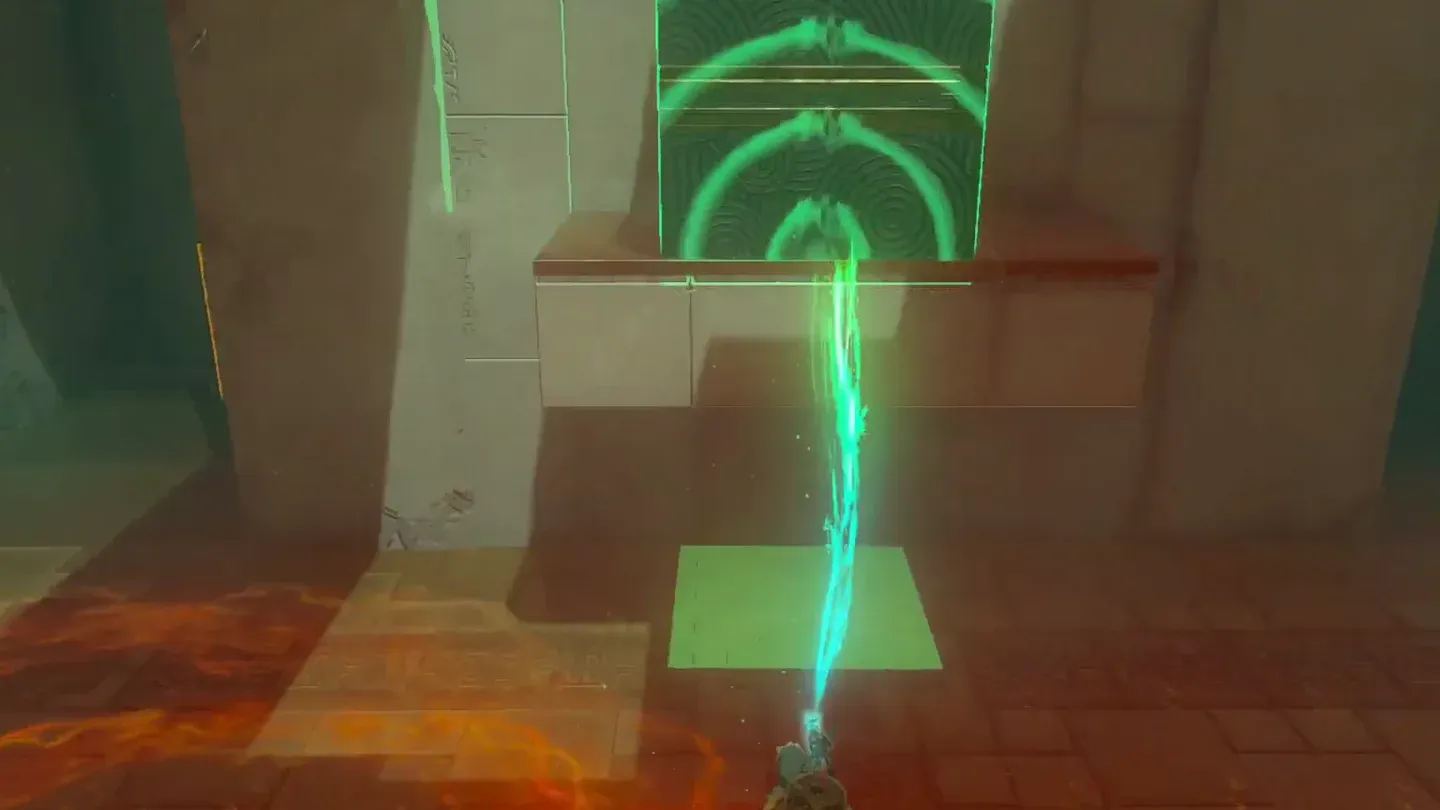 Ultrahand setting the metal cube down on top of the centre ledge