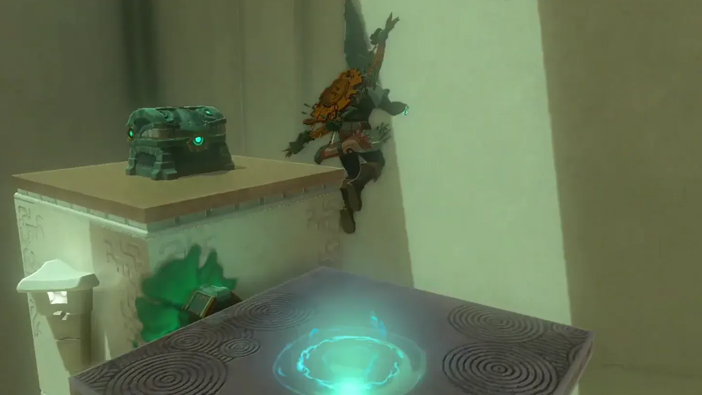 Link landing on the high platform next to the chest